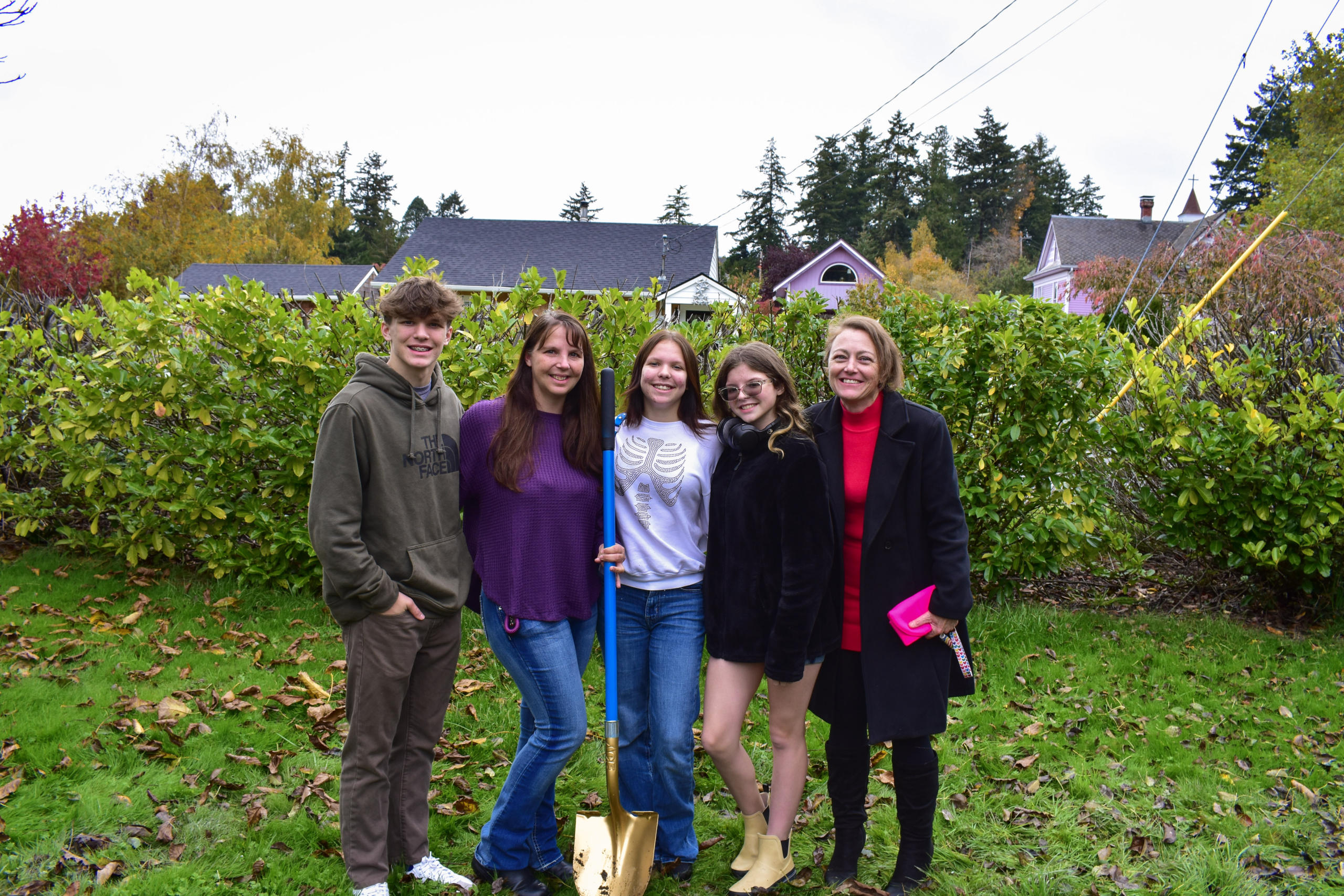 April Patterson standing with Tarra's family at Skagit Habitat for Humanity's Ground Breaking Ceremony in La Conner.