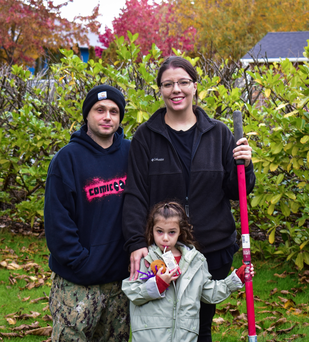 Homebuyer Program family, Steven, Steffanie, and Sequoia standing on the construction site at Skagit habitat's groundbreaking ceremony