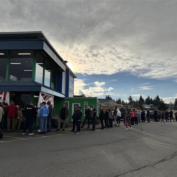 Long line of customers at the Skagit Habitat for Humanity Store reaching across the corner of the street